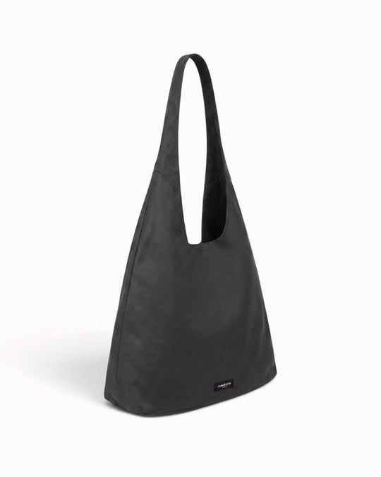 The Richelieu is Rive Droite's roomy hobo bag, made with a waxed finish to give their AW26 collection a richer colour and a worn in appearance over time