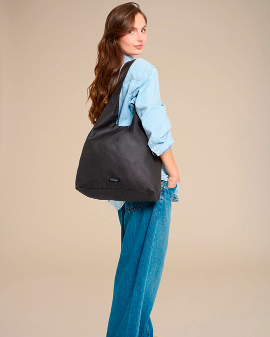 The Richelieu is Rive Droite's roomy hobo bag, made with a waxed finish to give their AW26 collection a richer colour and a worn in appearance over time