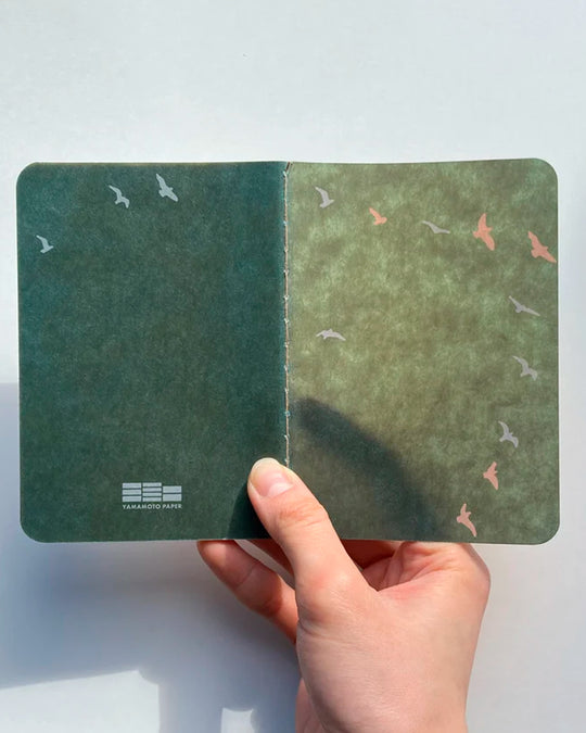 The Ro-biki Shape Series is a compact collection of illustrated cover notebooks with 5mm dot grid paper layout.