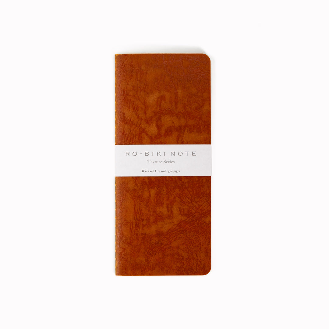 Ro-biki in Japanese means 'waxed'. Their refill notebooks will take on their own patina over time, and this is part of their charm.