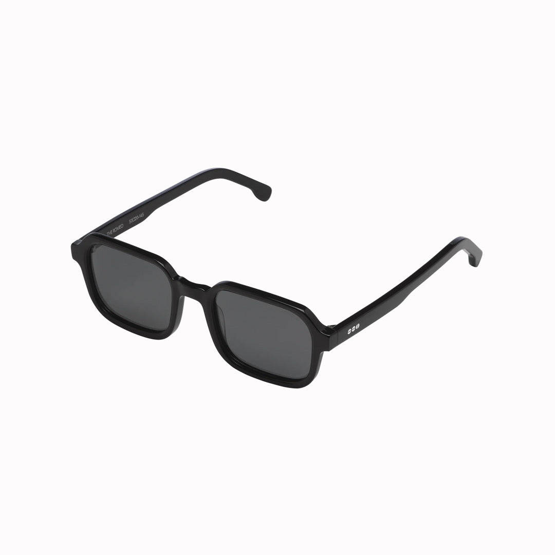 Sideways View of the Romeo in Black, The perfect combination of cool and comfort: the Romeo is a no-nonsense style. Your perfect partner in crime during this summer.With a black Recycled Acetate frame and solid smoke lenses, these sunglasses will keep you looking stylish and cool in any situation.