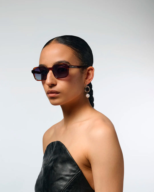 The Romeo takes a sharper approach to classic rectangular eyewear, with a slim acetate frame and controlled geometric lines.