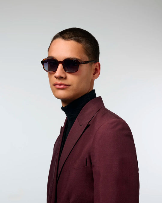 The Romeo takes a sharper approach to classic rectangular eyewear, with a slim acetate frame and controlled geometric lines.