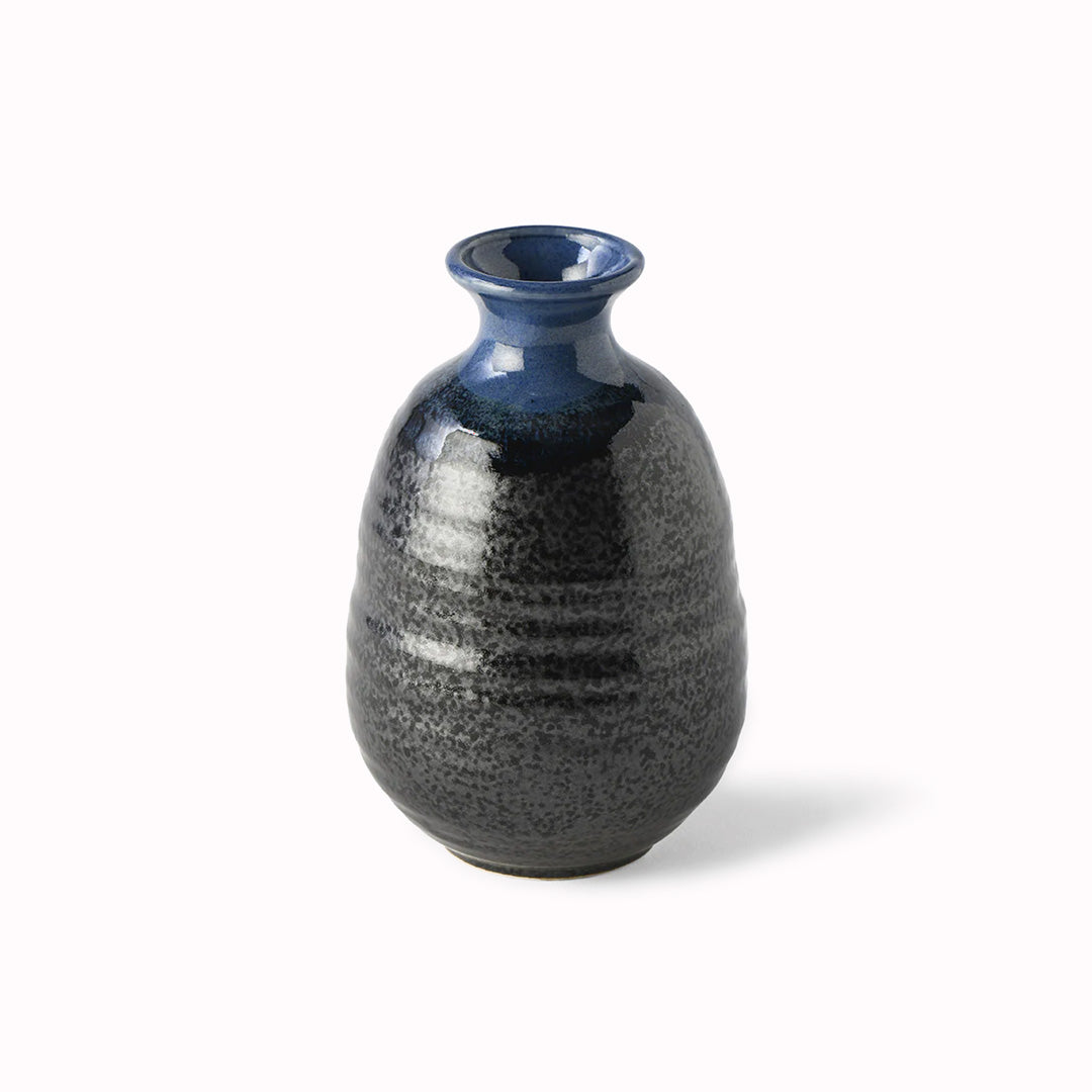 Japanese Sake jug featuring a black glaze with a dark blue top.
