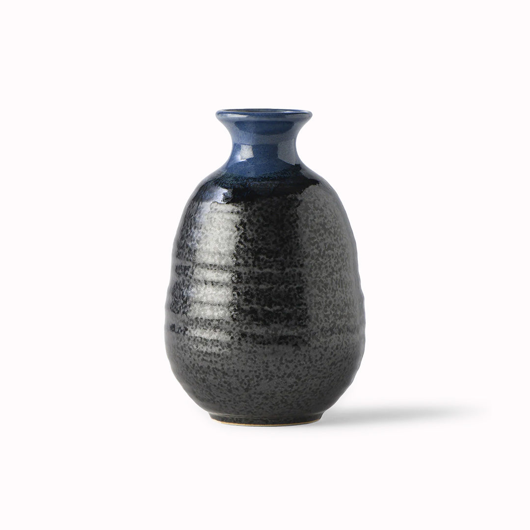 Side View - Japanese Sake jug featuring a black glaze with a dark blue top.