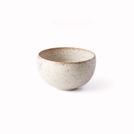 A small deep U shaped bowl made from 'Minoyaki' porcelain to mix and match with other pieces from the Sand Fade tableware collection. 13cm diameter and 7.5cm high