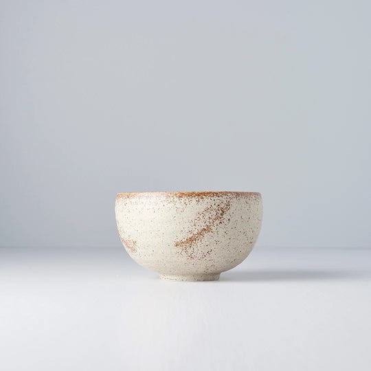 A small deep U shaped bowl made from 'Minoyaki' porcelain to mix and match with other pieces from the Sand Fade tableware collection. 13cm diameter and 7.5cm high