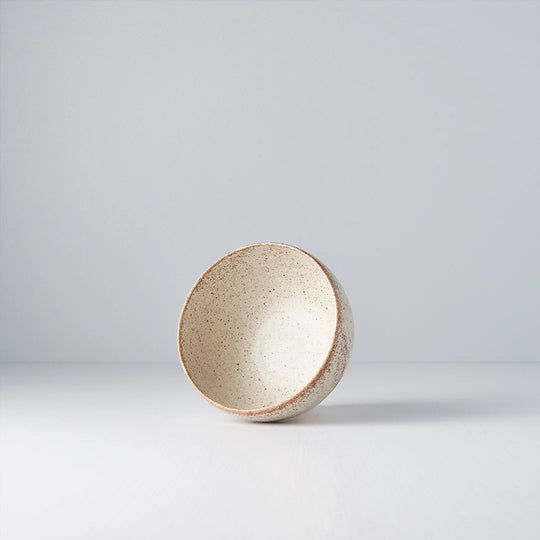 A small deep U shaped bowl made from 'Minoyaki' porcelain to mix and match with other pieces from the Sand Fade tableware collection. 13cm diameter and 7.5cm high