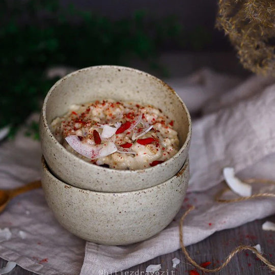 A small deep U shaped bowl made from 'Minoyaki' porcelain to mix and match with other pieces from the Sand Fade tableware collection. 13cm diameter and 7.5cm high