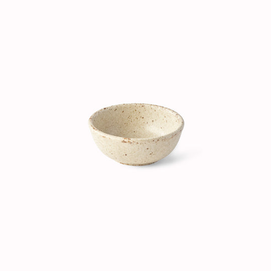 The Sand Fade Glaze features a warm, sandy tone with touches of hazel brown. Each piece has a unique dappled pattern determined by its position in the kiln during the firing process.