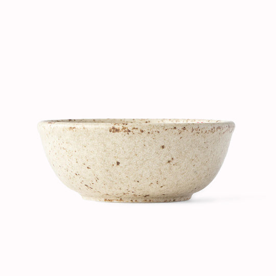 The Sand Fade Glaze features a warm, sandy tone with touches of hazel brown. Each piece has a unique dappled pattern determined by its position in the kiln during the firing process.