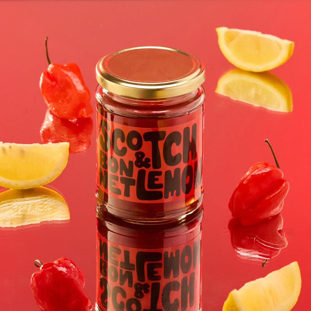 The Scotch Bonnet &amp; Lemon Pickling Liquid from Sylt Pickling is a fiery concoction that promises to ignite your taste buds with its blend of eye-watering chillies and refreshing lemon zest.