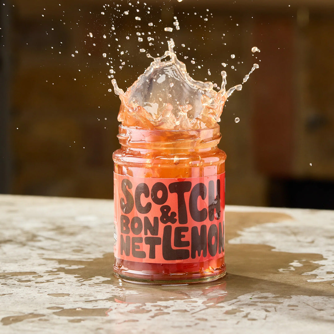 The Scotch Bonnet &amp; Lemon Pickling Liquid from Sylt Pickling is a fiery concoction that promises to ignite your taste buds with its blend of eye-watering chillies and refreshing lemon zest.