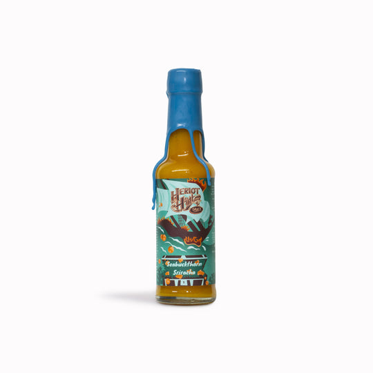Heriot Hott’s Seabuckthorn Sriracha Hott Sauce, a uniquely flavoured twist on classic sriracha that brings a fruity, tangy kick to your meals.