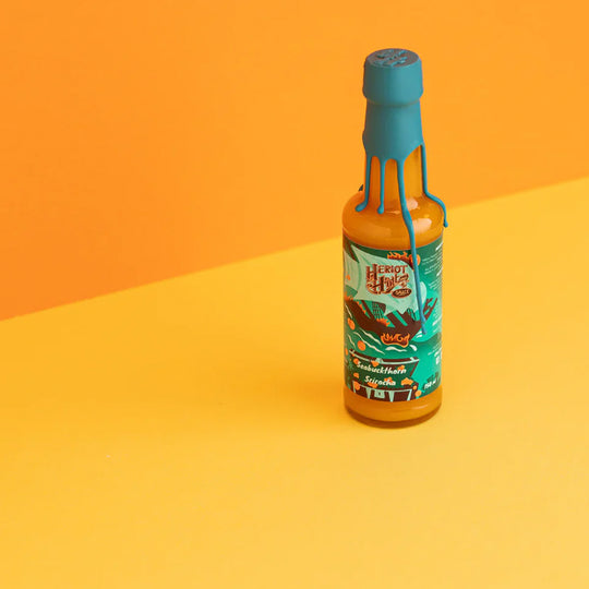 Heriot Hott’s Seabuckthorn Sriracha Hott Sauce, a uniquely flavoured twist on classic sriracha that brings a fruity, tangy kick to your meals. Lifestyle