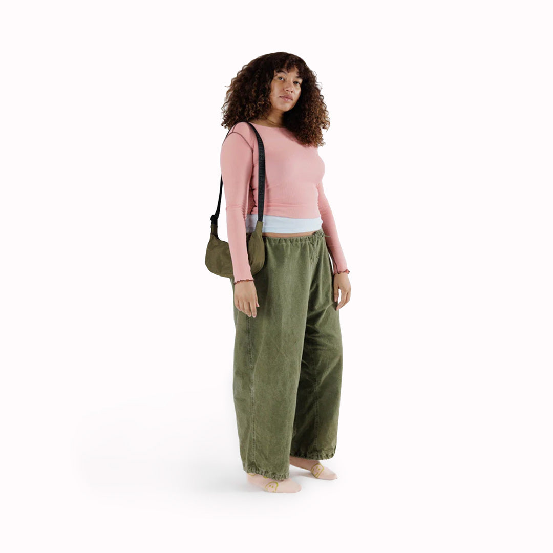As Worn - The Small Crescent Bag in Seaweed from Baggu is a stylish and versatile accessory that can complement any outfit.