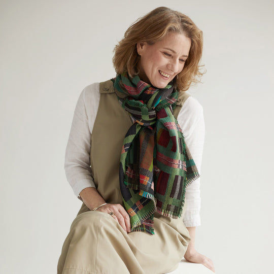 The Sedge Pasture lambswool scarf by Wallace and Sewell showcases the intricate craft of textile design, blending traditional techniques with modern aesthetics.