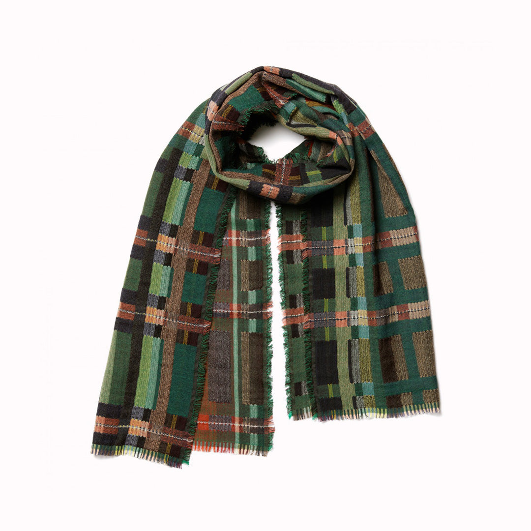 The Sedge Pasture lambswool scarf by Wallace and Sewell showcases the intricate craft of textile design, blending traditional techniques with modern aesthetics.