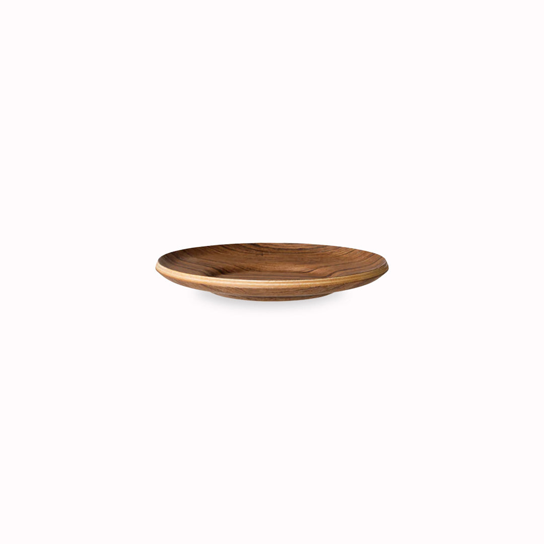 The Sepia teak saucer by Kinto Japan is a stylish and functional accessory for your coffee or tea time. The saucer is made of natural teak wood, which has a warm and rich color and a smooth texture.