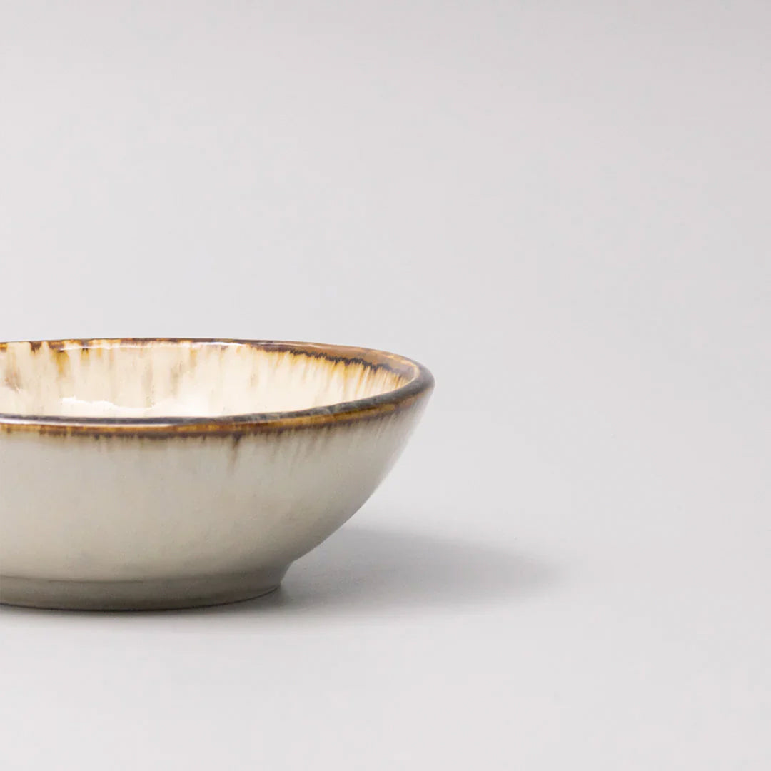 A warm creamy toned shallow bowl perfect for dips and sauces, gently flared with warm toasted rim and a natural speckle