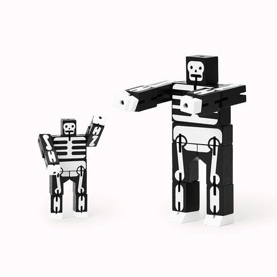 Cubebot is a fun wooden toy robot that folds out of a perfect cube shape. Part puzzle, part posable toy they are inspired by Japanese Shinto Kumi-ki puzzles and can be positioned to hold dozens of poses