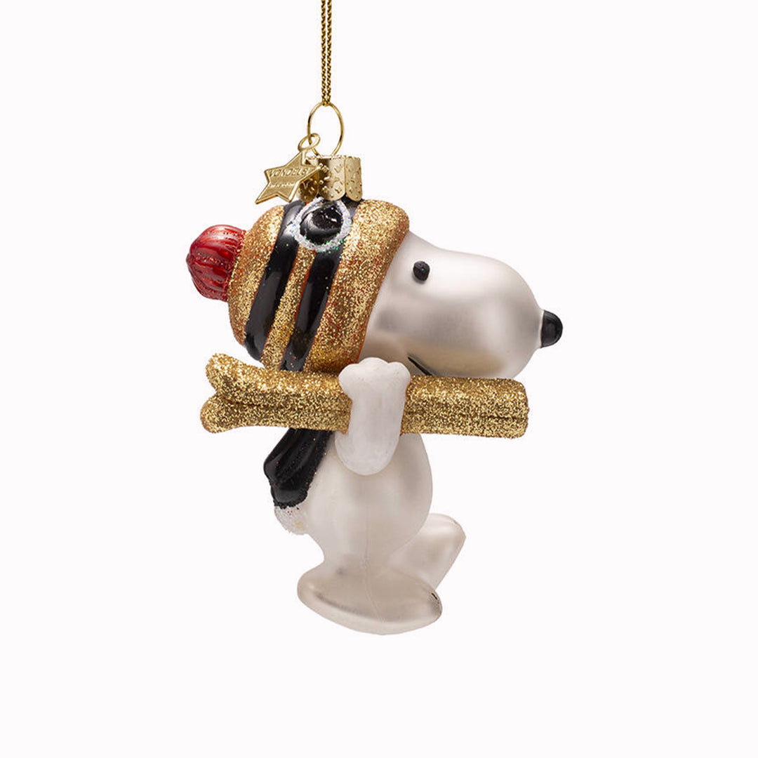 Inject some sparkly fun into your Christmas tree with this hand painted and mouth blown glass Skiing Snoopy