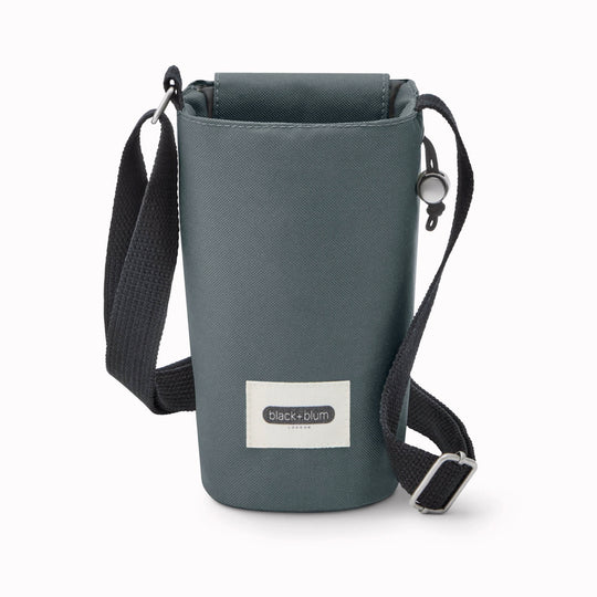 This insulated bottle bag in slate from Black+Blum is a practical, everyday carrier that keeps your bottle cool and your hands free. 