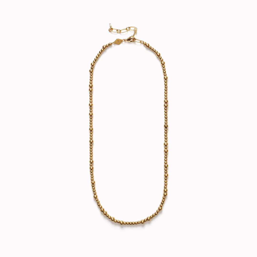 The Anni Lu Slim Goldie necklace is a versatile piece of jewellery that offers a classic look when worn alone and a stunning appeal when layered with other pieces from the collection