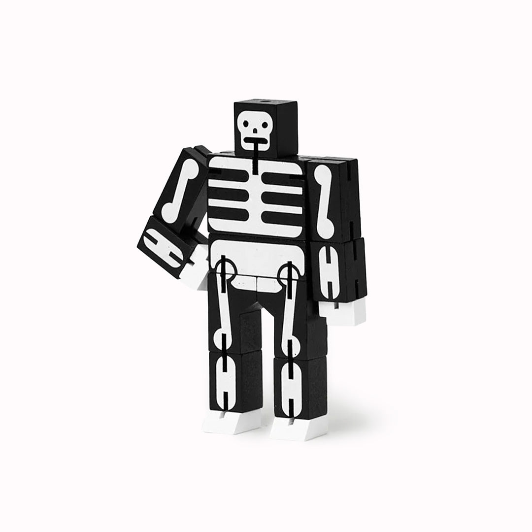 Cubebot is a fun wooden toy robot that folds out of a perfect cube shape. Part puzzle, part posable toy they are inspired by Japanese Shinto Kumi-ki puzzles and can be positioned to hold dozens of poses