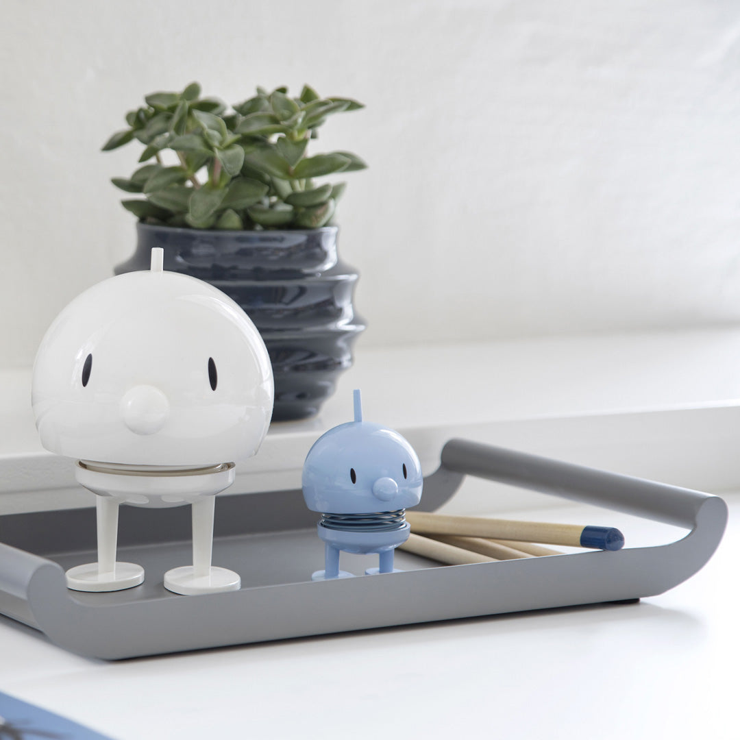 Playfully designed small Hoptimist in light blue from the Danish designers Hoptimist. Most smiles are triggered by another smile.