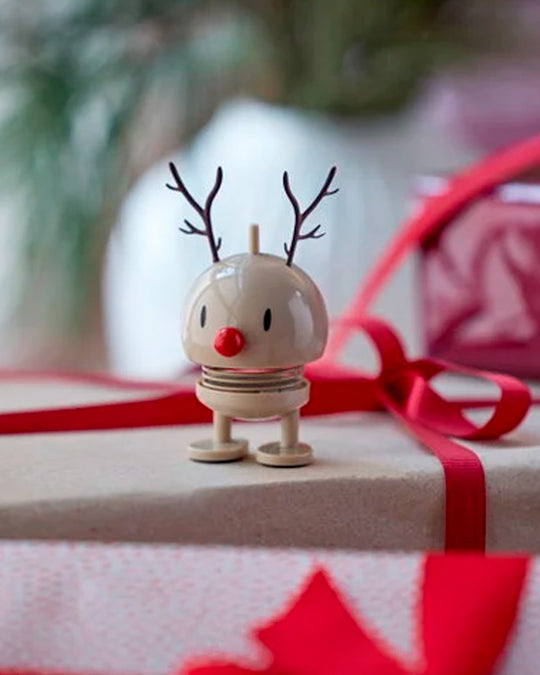 The classic Hoptimist Bumble gets a festive update with reindeer antlers and a warm Latte finish.