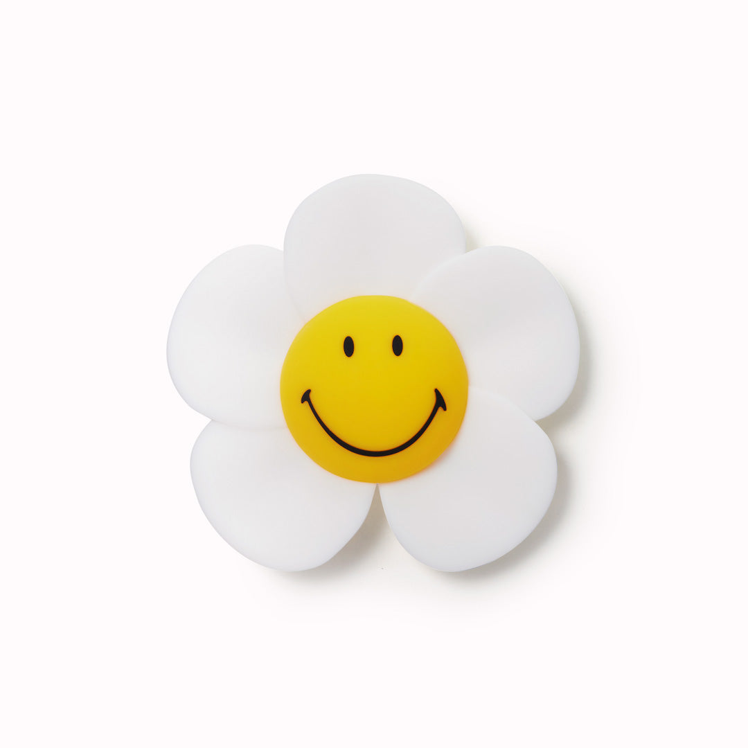 The Mr Maria Smiley Daisy lamp is a delightful addition to any room, offering not just illumination but also a touch of timeless joy with the Smiley brand - pictured off