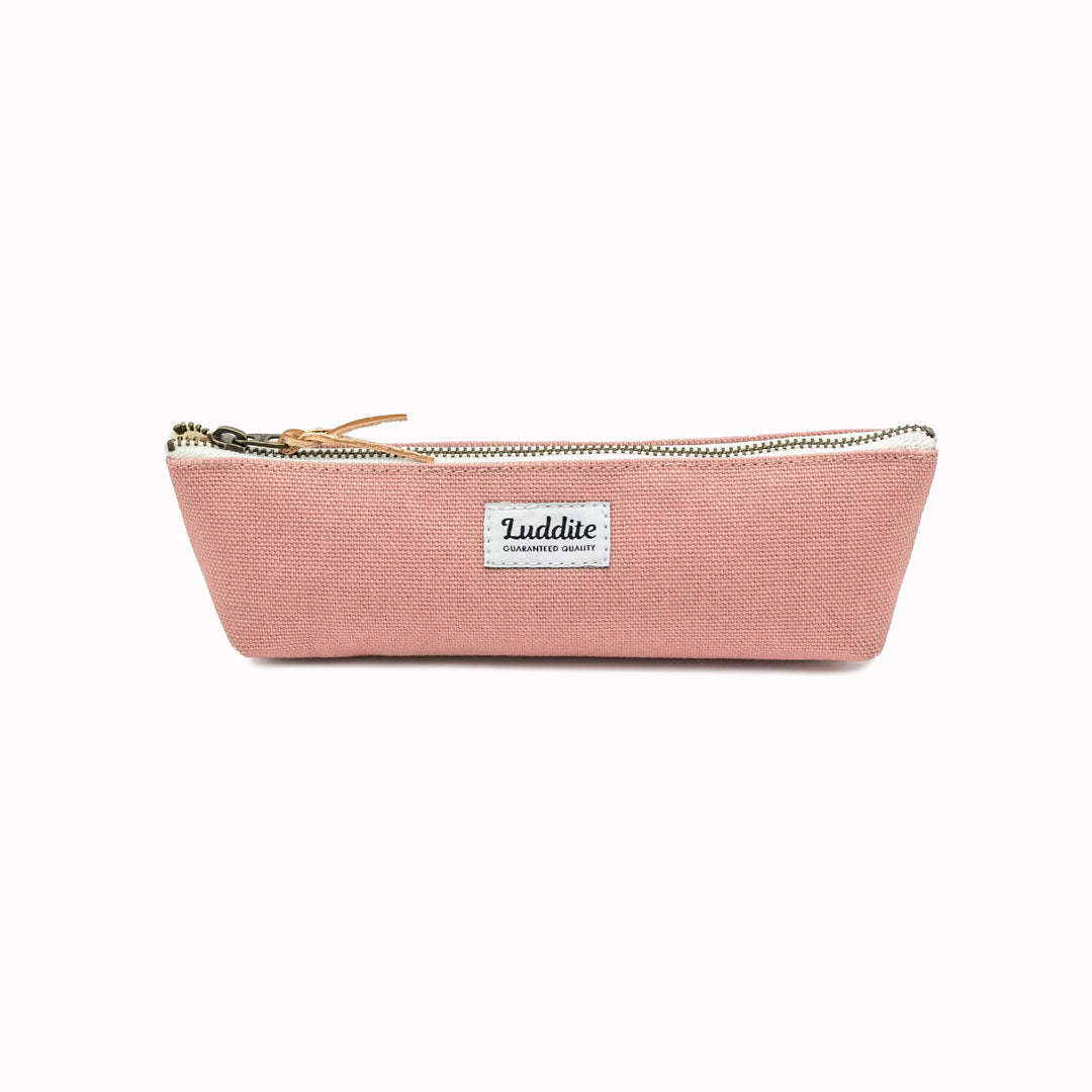 Boat shaped pen and pencil case by Japanese stationery brand Luddite.  The durable and tactile pencil case features a zipper along the length of the pencil case allows easy access to the items inside.