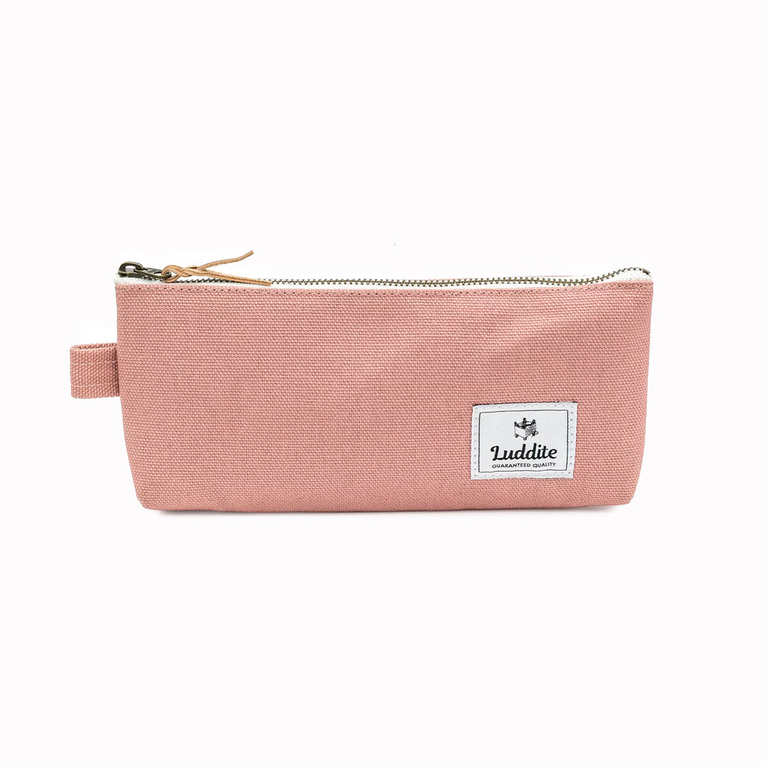 Flat pouch style pen and pencil case by Japanese stationery brand Luddite. the durable and tactile pencil case features a zipper along the length of the pencil case allows easy access to the items inside.