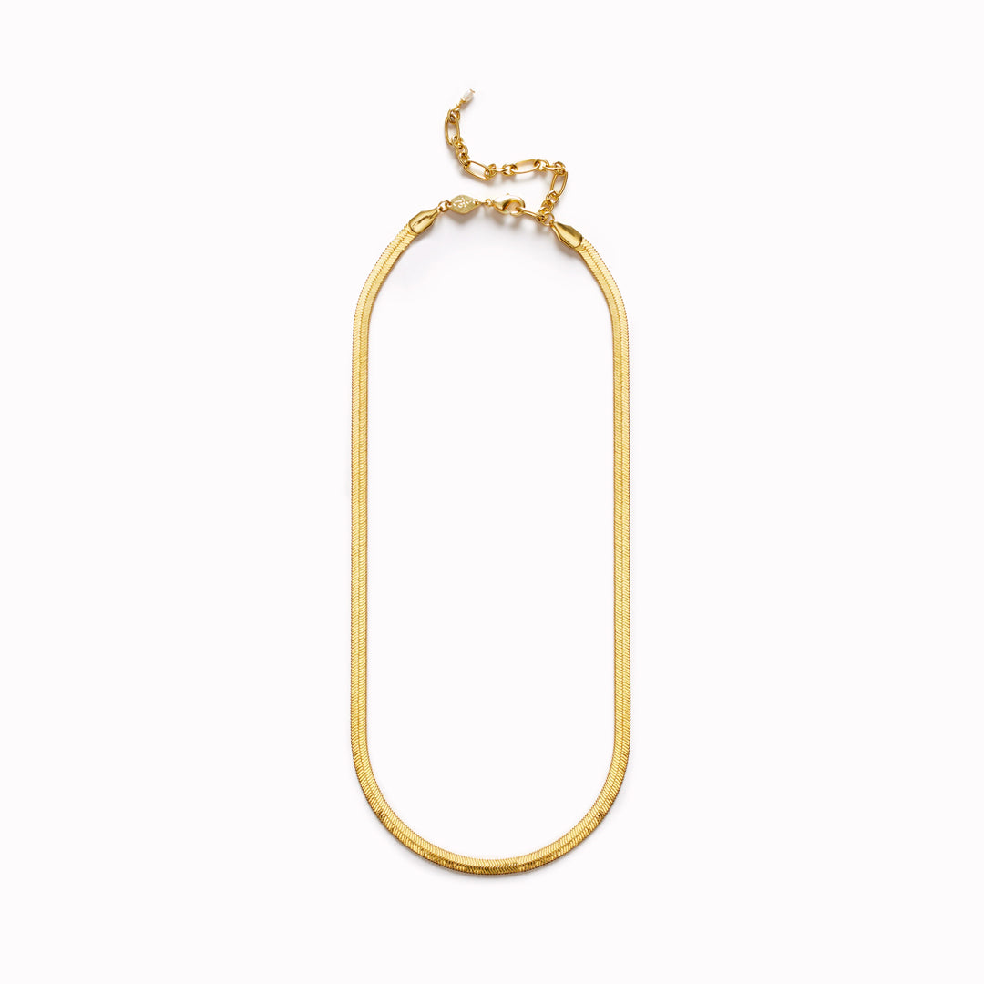 A neat, fluid chain with a slightly sculptural feel, the Snake Charmer Necklace sits cleanly along the collarbone and moves naturally with the wearer.