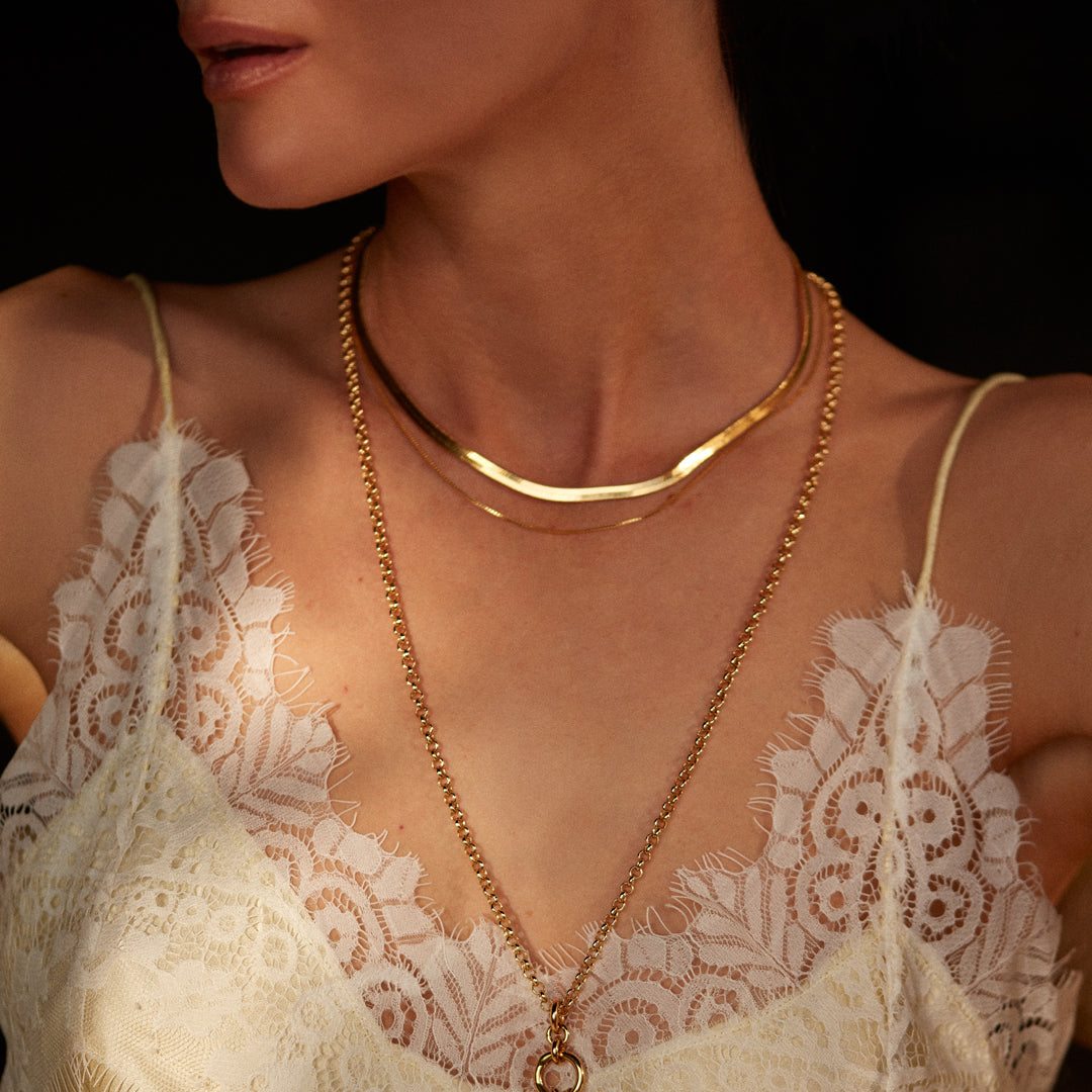 A neat, fluid chain with a slightly sculptural feel, the Snake Charmer Necklace sits cleanly along the collarbone and moves naturally with the wearer.
