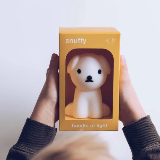 The Snuffy Bundle of Light Nightlight is made of soft silicone and gives a peaceful and subtle light.

This little friend with a gentle smile will keep a close eye when bedtime comes.