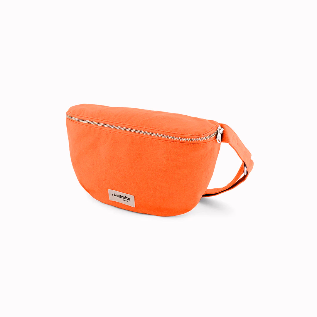 The Custine Belt Bag by Rive Droite Paris is a compact belt bag made from a bright Soda Orange recycled cotton fabric.