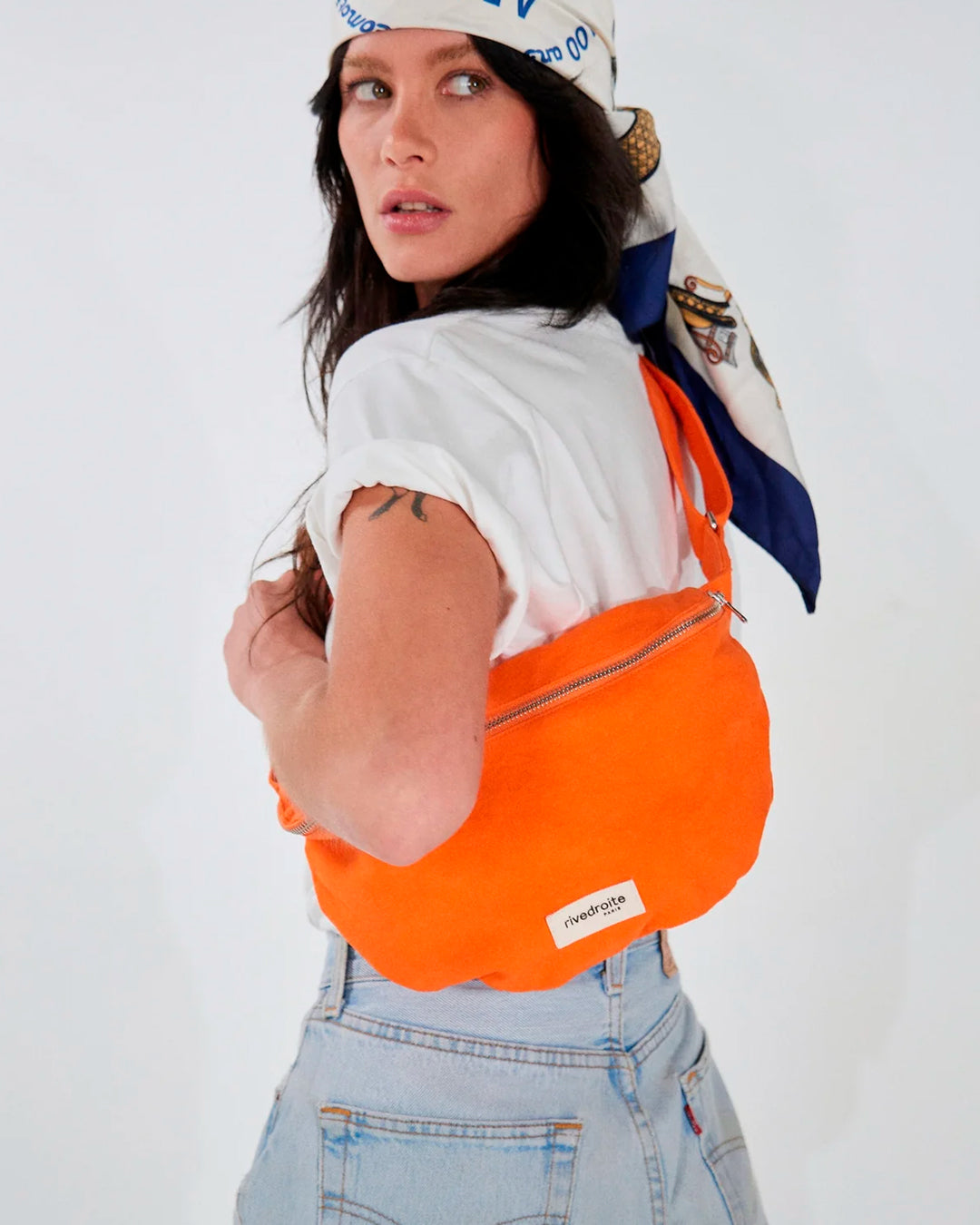 The Custine Belt Bag by Rive Droite Paris is a compact belt bag made from a bright Soda Orange recycled cotton fabric.