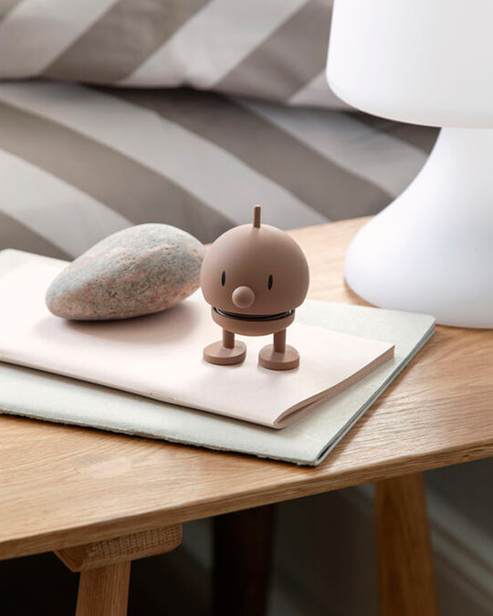 Bumble, the classic Hoptimist creation has a happy face and bouncy wobbly head which brings the little figurine to life and works as a symbol of positive optimism and good humour