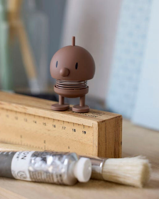 Bumble, the classic Hoptimist creation has a happy face and bouncy wobbly head which brings the little figurine to life and works as a symbol of positive optimism and good humour