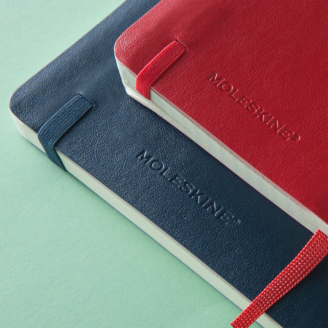 The Moleskine's Classic Notebook range, which traces its origins to the legendary notebooks used by artists and writers over the centuries. The pocket version boasts an elastic closure and matching ribbon bookmark, uses FSC paper and has an expandable inner pocket and lay flat binding AND fits nicely in your bag.