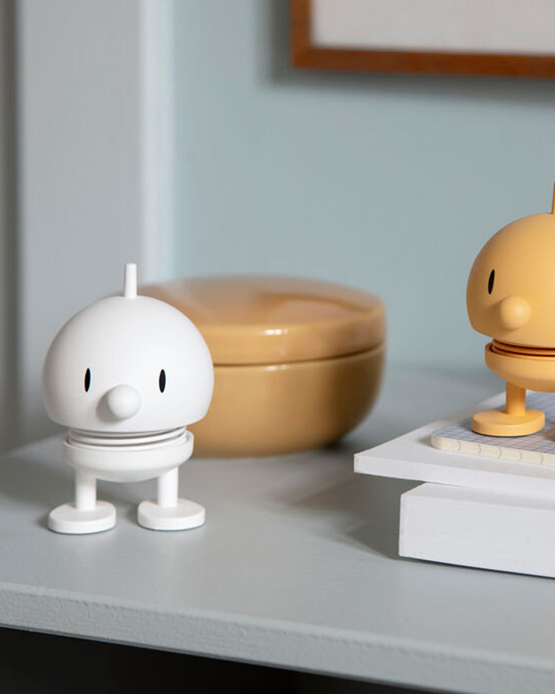 Bumble, the classic Hoptimist creation has a happy face and bouncy wobbly head which brings the little figurine to life and works as a symbol of positive optimism and good humour