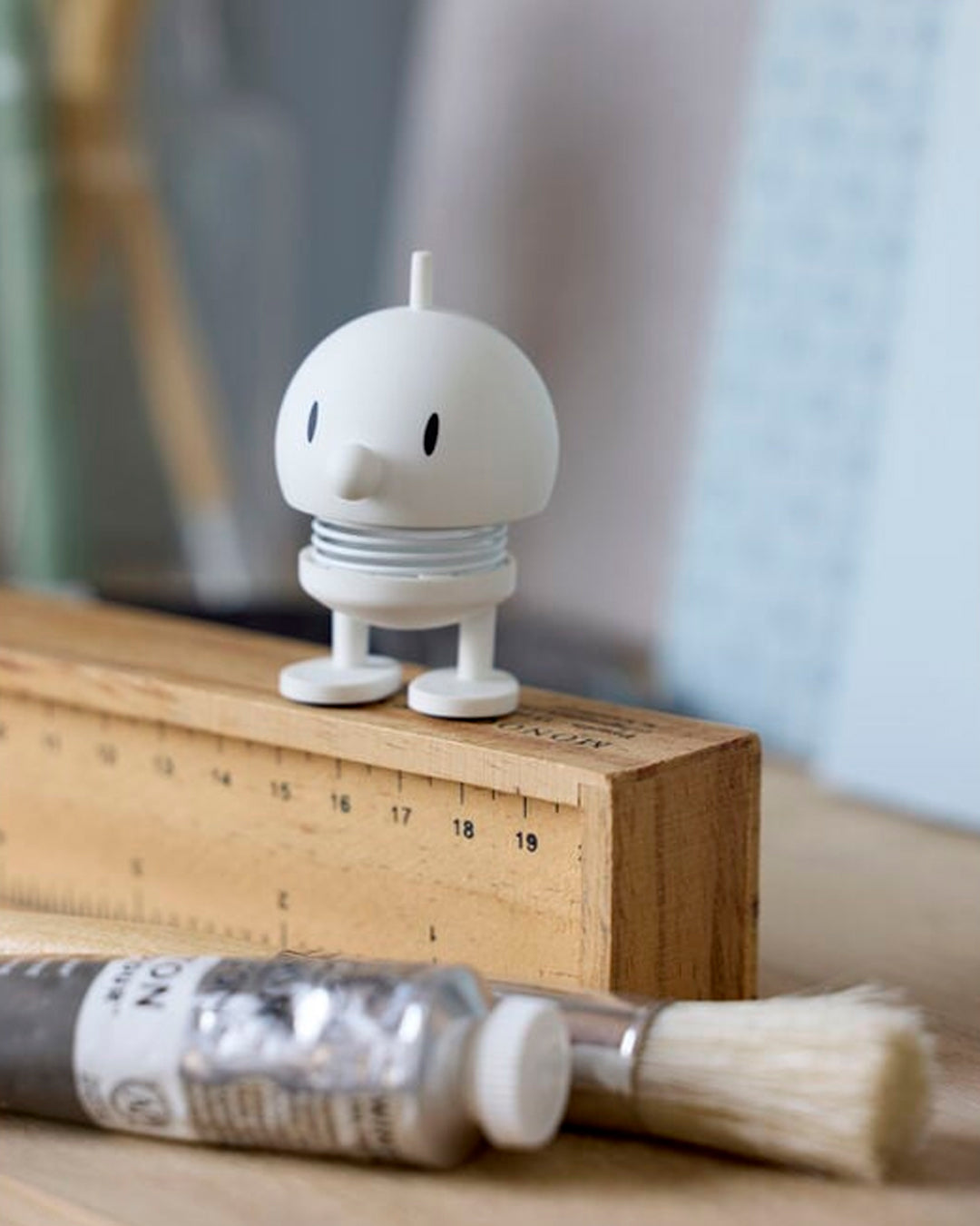 Bumble, the classic Hoptimist creation has a happy face and bouncy wobbly head which brings the little figurine to life and works as a symbol of positive optimism and good humour