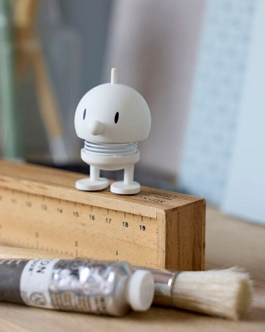 Bumble, the classic Hoptimist creation has a happy face and bouncy wobbly head which brings the little figurine to life and works as a symbol of positive optimism and good humour