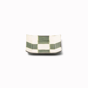 The Oribe Green Glaze features a mottled green with a yellow underglaze. Each piece has a unique dappled pattern determined by its position in the kiln during the firing process.