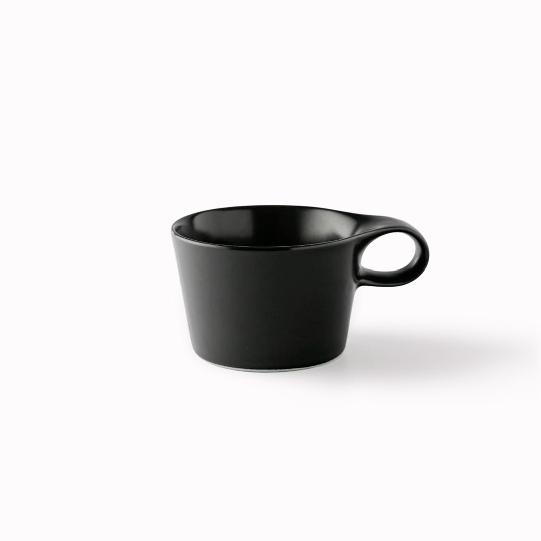 The Stamug is a porcelain mug with 150ml capacity for tea or shorter coffee drinks. Finished in an even matt black glaze.