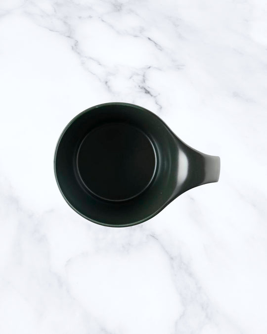 The Stamug is a porcelain mug with 150ml capacity for tea or shorter coffee drinks. Finished in an even matt black glaze.