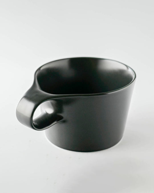 The Stamug is a porcelain mug with 150ml capacity for tea or shorter coffee drinks. Finished in an even matt black glaze.