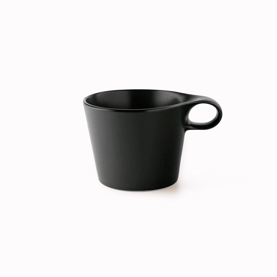 The Stamug is a porcelain mug with a compact 250ml capacity. Finished in an even matt black glaze.